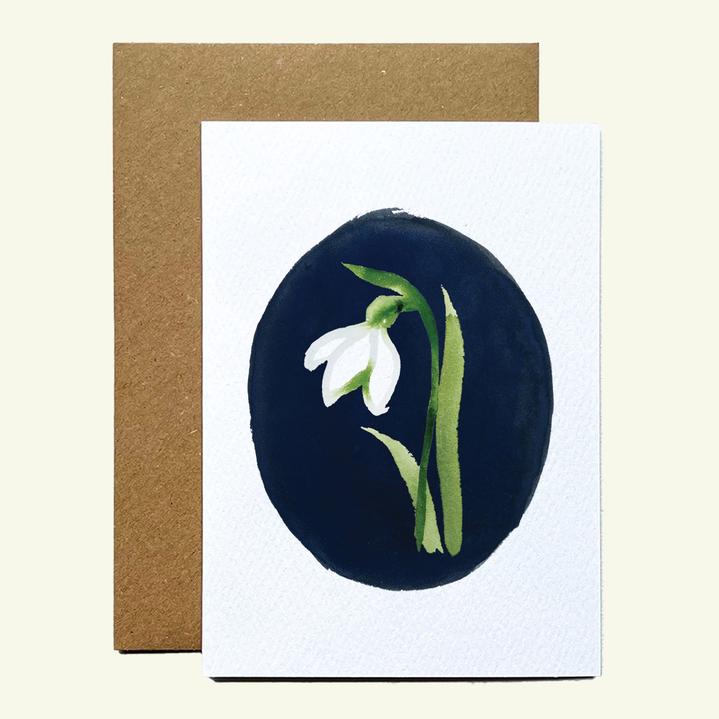 Greeting card with hand painted snowdrop on a blue background