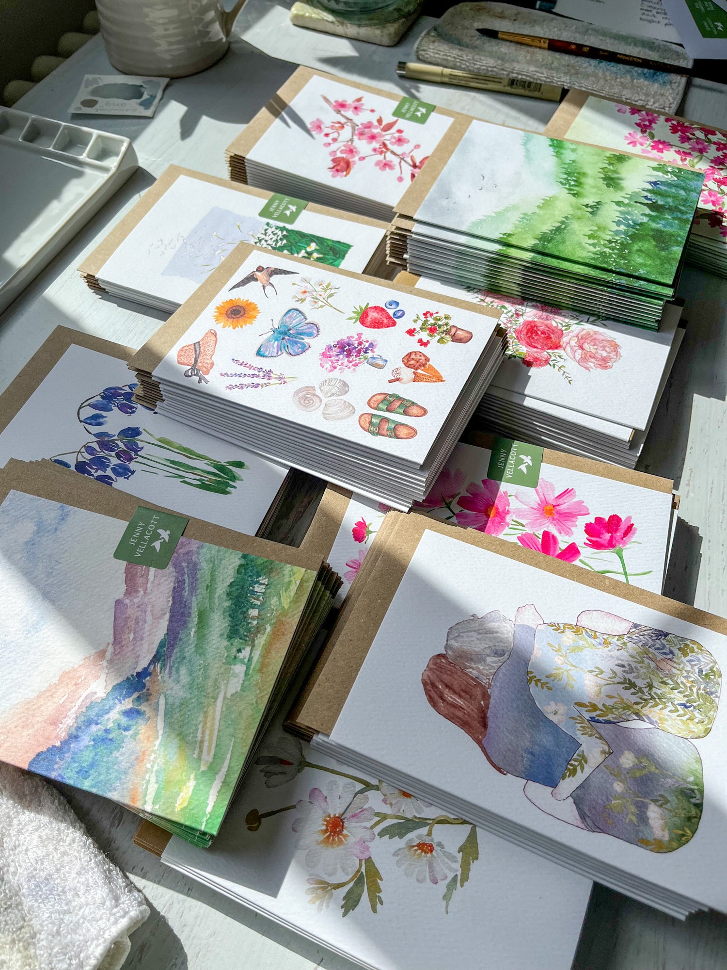 Stack of greeting cards on a desk being prepared for a wholesale order